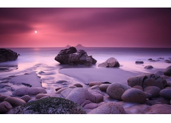 大海海滩沙滩岸边岩石晚霞风景风光景观照片